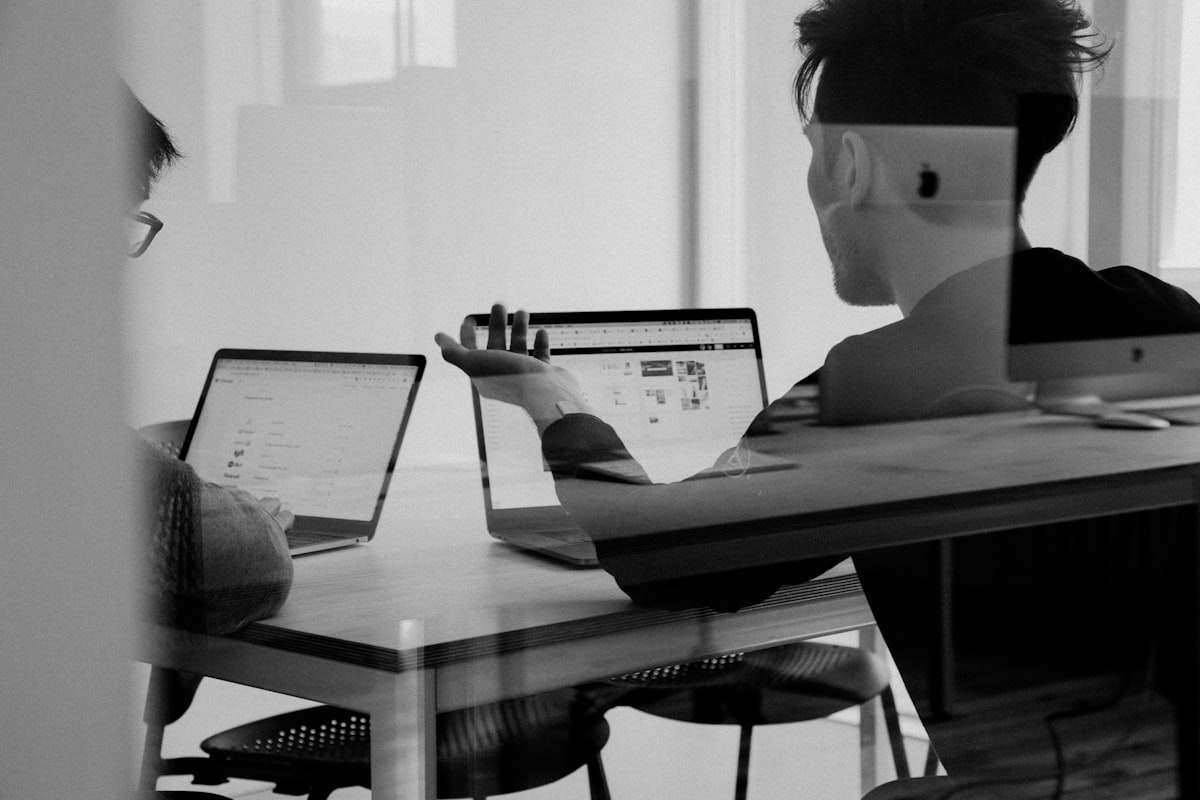 Energy analyst reviewing data on laptop in office